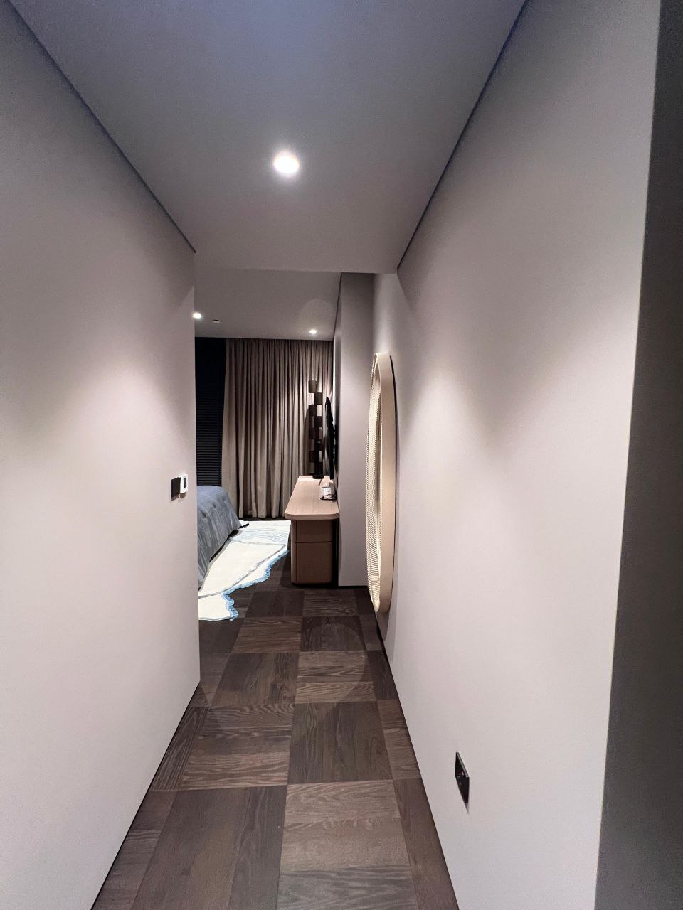 Corridor opening into the master bedroom — penthouse, Dubai Marina