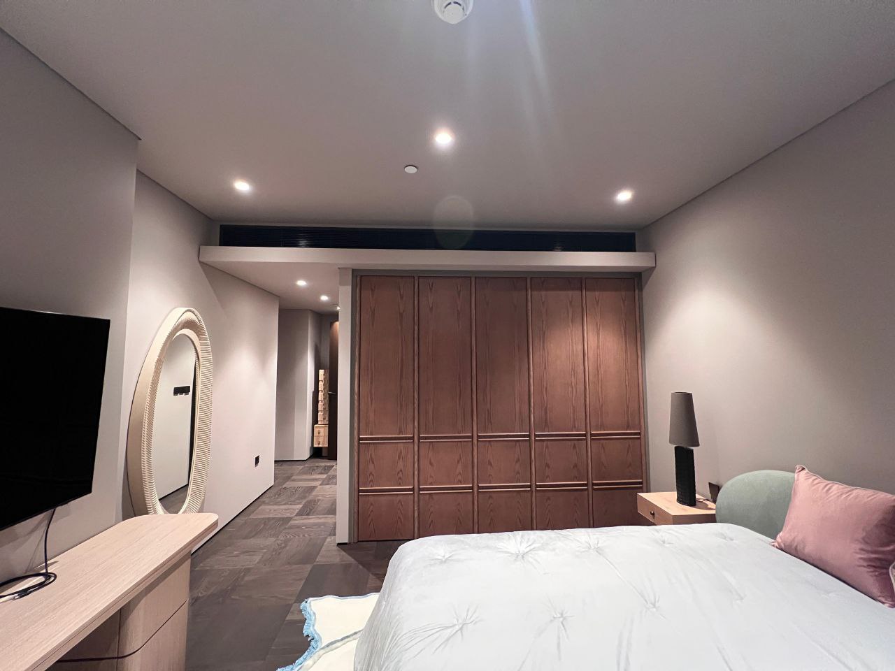 Bedroom with fitted walnut wardrobe and joinery