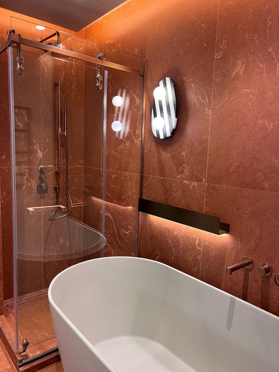 Red-marble bathroom with freestanding tub — villa, Palm Jumeirah
